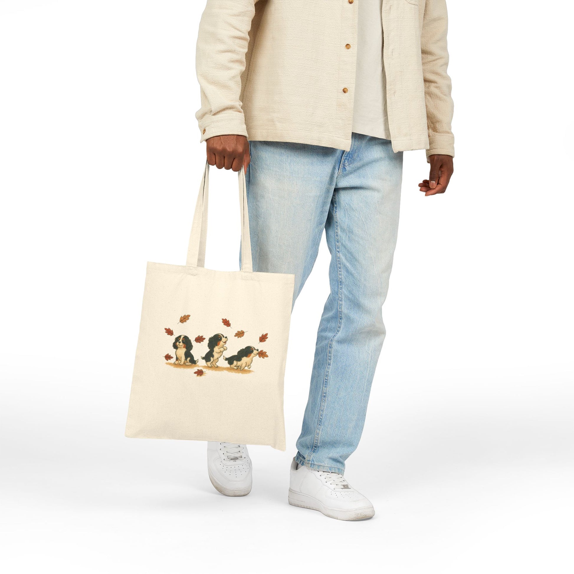 Tricolor Cavalier Chasing Leaves Tote Bag