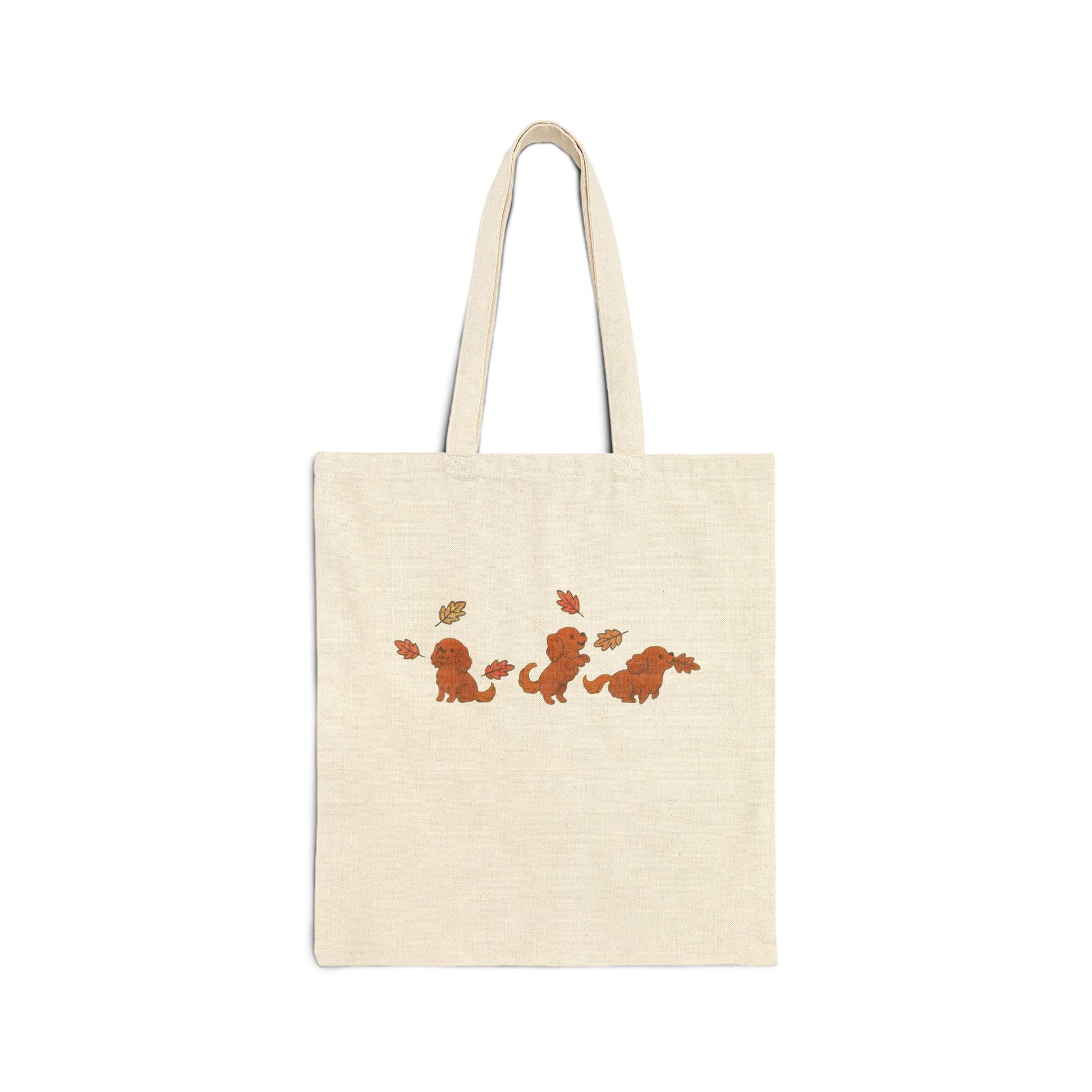 Ruby Cavalier Chasing Leaves Tote Bag