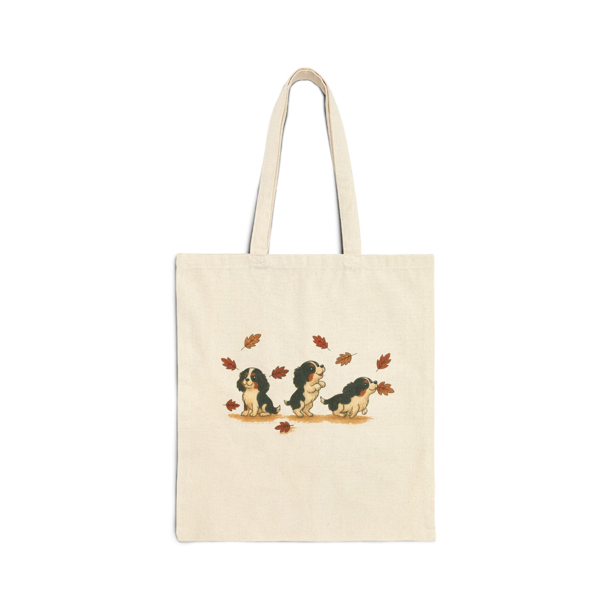 Tricolor Cavalier Chasing Leaves Tote Bag