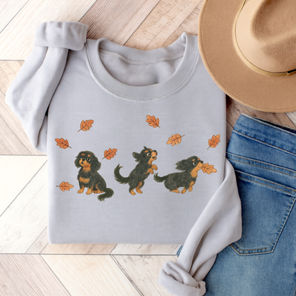 Black Tan Cavalier Chasing Leaves Sweatshirt Ash