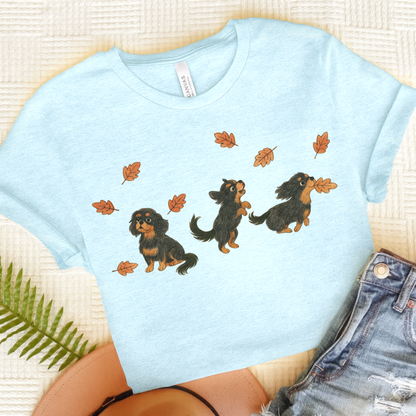 Black Tan Cavalier Chasing Leaves TShirt Heather Ice Blue