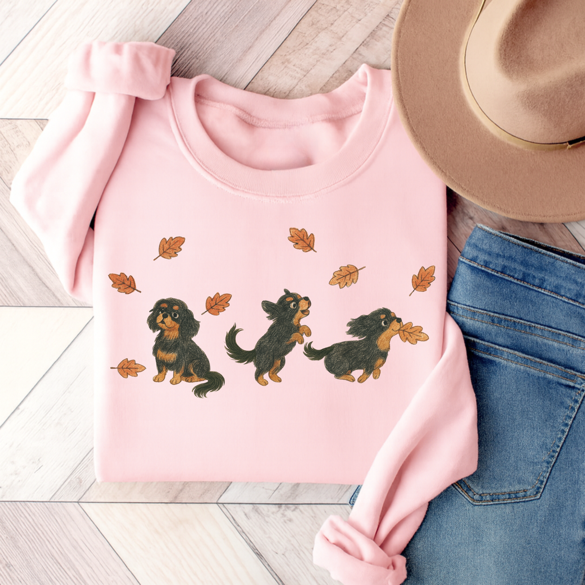 Black Tan Cavalier Chasing Leaves Sweatshirt Light Pink