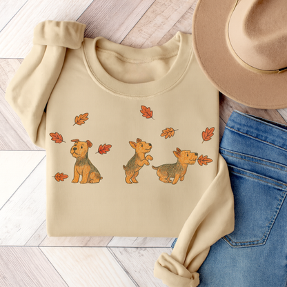 Airedale Terrier Chasing Leaves Sweatshirt Sand