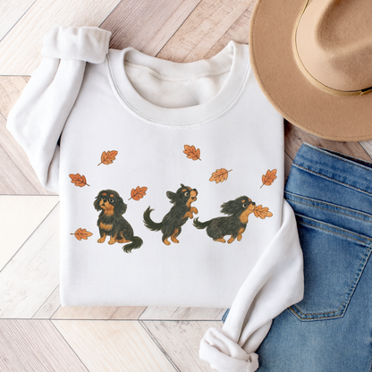 Black Tan Cavalier Chasing Leaves Sweatshirt White