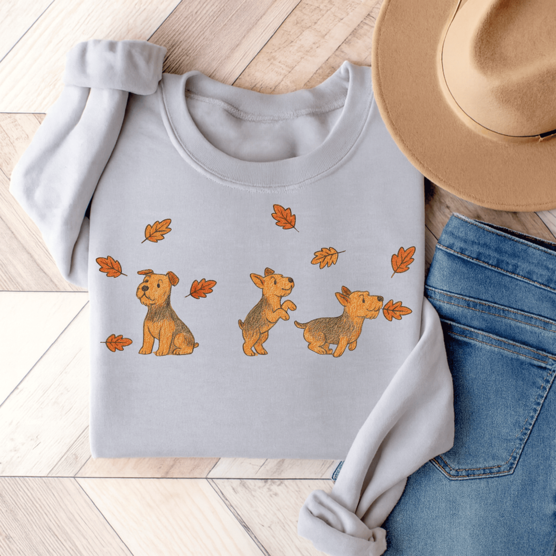 Airedale Terrier Chasing Leaves Sweatshirt Ash