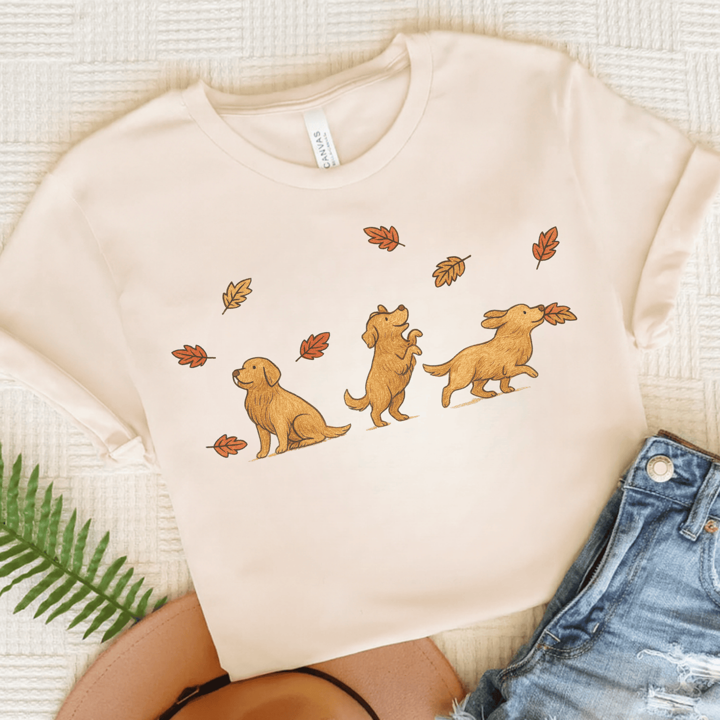 Golden Retriever Chasing Leaves Unisex TShirt Natural