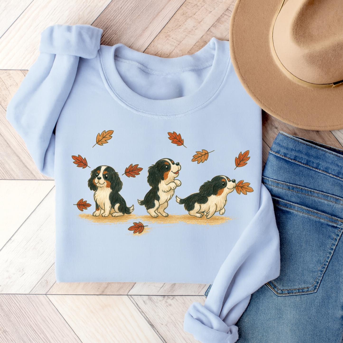 Tricolor Cavalier Chasing Leaves Sweatshirt Light Blue